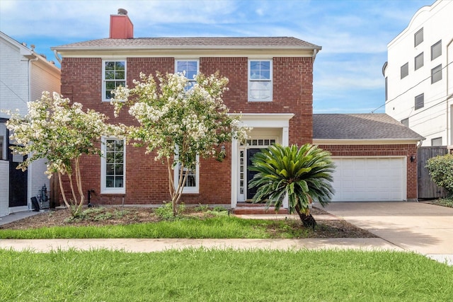 1976 Vermont St, Houston, TX 77019 - view of front facade featuring a chimney, brick siding, a garage, and concrete driveway