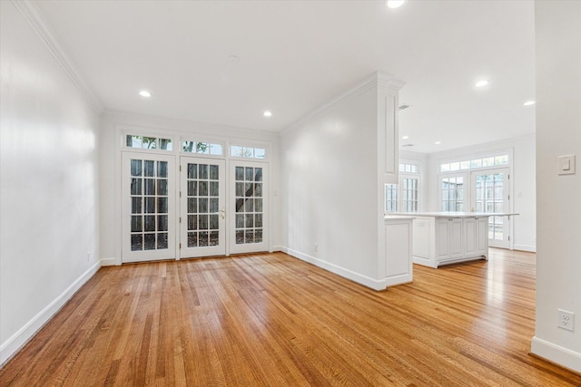 1976 Vermont St, Houston, TX 77019 - empty room featuring light wood-style floors, ornamental molding, and recessed lighting