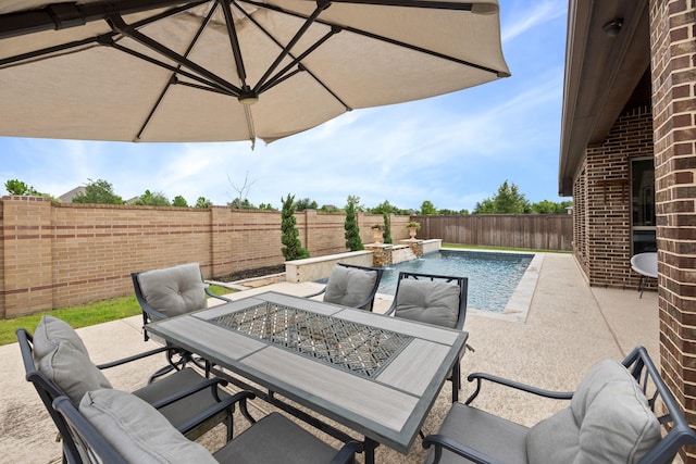 19219 Spotted Bass Ln, Cypress, TX 77433 - fenced backyard featuring outdoor dining area, a patio area, and a pool with connected hot tub