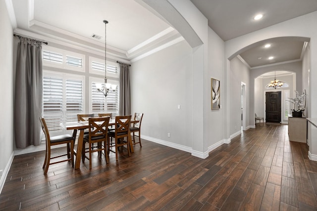 19219 Spotted Bass Ln, Cypress, TX 77433 - dining room with a chandelier, arched walkways, dark wood finished floors, crown molding, and recessed lighting