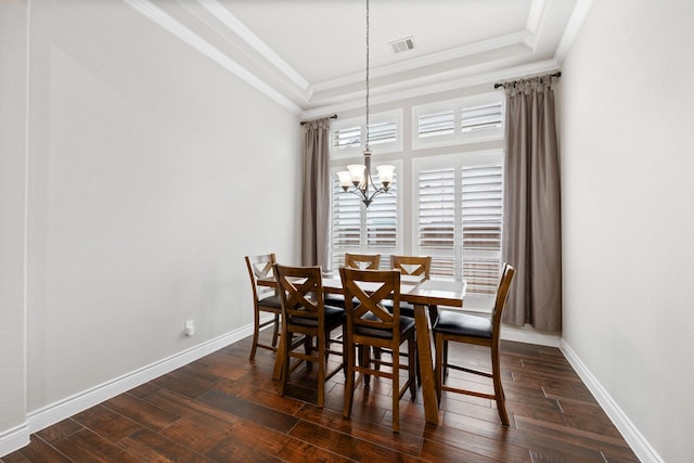 19219 Spotted Bass Ln, Cypress, TX 77433 - dining space with a raised ceiling, dark wood-type flooring, ornamental molding, and a chandelier