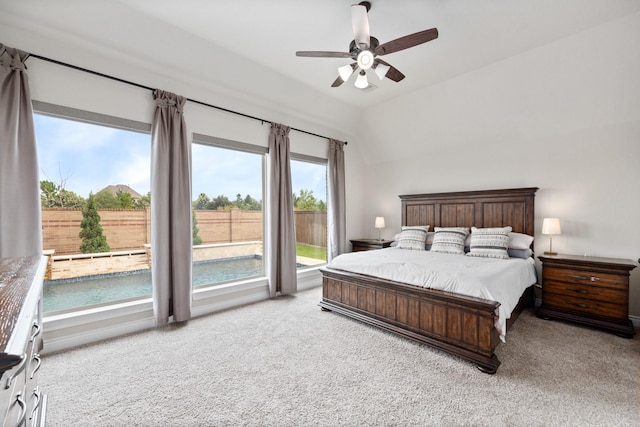 19219 Spotted Bass Ln, Cypress, TX 77433 - bedroom with carpet, multiple windows, access to outside, and vaulted ceiling