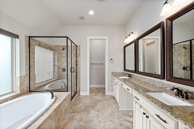 19219 Spotted Bass Ln, Cypress, TX 77433 - full bathroom featuring double vanity, a garden tub, a stall shower, and plenty of natural light