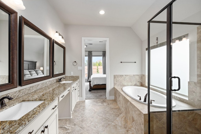 19219 Spotted Bass Ln, Cypress, TX 77433 - ensuite bathroom with double vanity, a garden tub, a shower stall, and vaulted ceiling