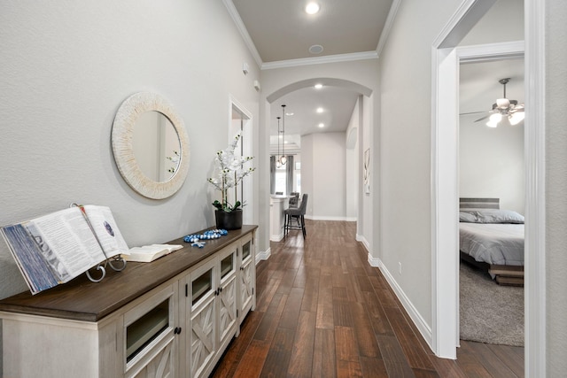 19219 Spotted Bass Ln, Cypress, TX 77433 - hallway with dark wood-style flooring, arched walkways, crown molding, and recessed lighting