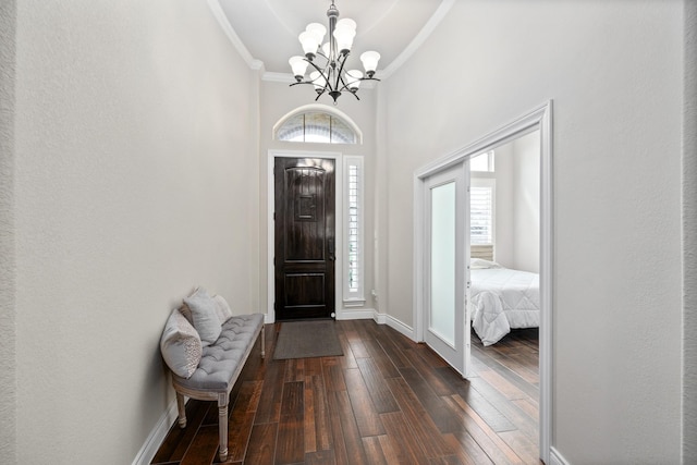 19219 Spotted Bass Ln, Cypress, TX 77433 - entrance foyer with a chandelier, dark wood finished floors, plenty of natural light, and crown molding