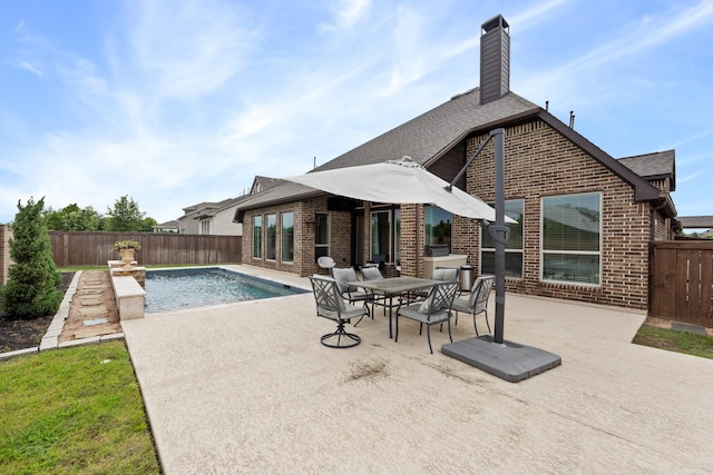 19219 Spotted Bass Ln, Cypress, TX 77433 - view of swimming pool featuring a patio area, a fenced backyard, and outdoor dining area