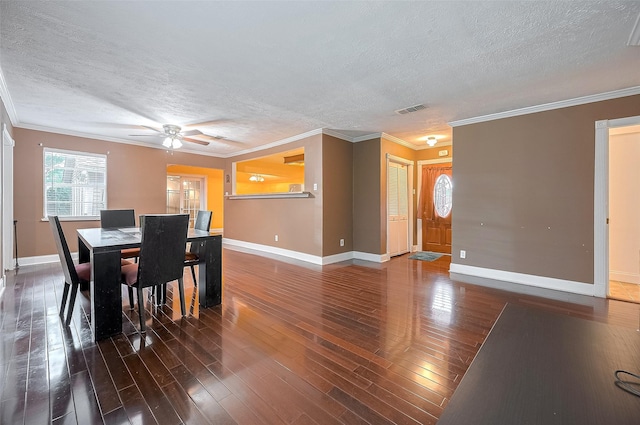 4610 Brinkman St, Houston, TX 77018 - dining space with a textured ceiling, ornamental molding, ceiling fan, and wood finished floors
