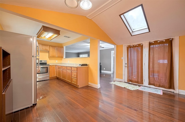 4610 Brinkman St, Houston, TX 77018 - kitchen featuring stainless steel electric stove, light brown cabinetry, dark wood-style flooring, light countertops, and lofted ceiling