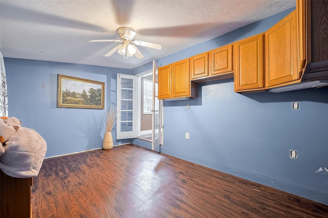 4610 Brinkman St, Houston, TX 77018 - kitchen with ceiling fan, dark wood-style flooring, a textured ceiling, and brown cabinets
