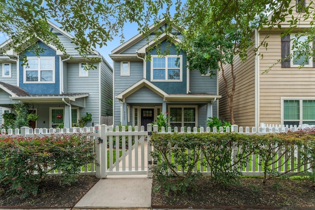 4663 Trembling Forest Ln, Houston, TX 77092 - view of front facade featuring a gate, a fenced front yard, and covered porch
