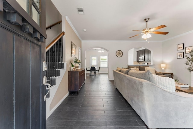 4663 Trembling Forest Ln, Houston, TX 77092 - living room with arched walkways, ceiling fan, and ornamental molding