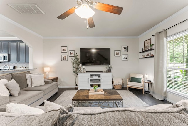 4663 Trembling Forest Ln, Houston, TX 77092 - living area with ornamental molding, plenty of natural light, dark wood-style flooring, and ceiling fan