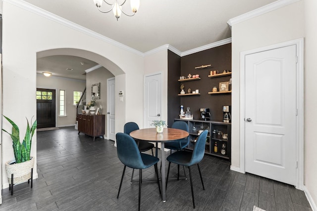 4663 Trembling Forest Ln, Houston, TX 77092 - dining space featuring arched walkways, dark wood-type flooring, crown molding, and a chandelier