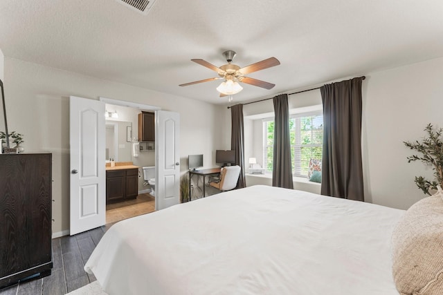 4663 Trembling Forest Ln, Houston, TX 77092 - bedroom featuring ensuite bathroom, wood finished floors, and a ceiling fan