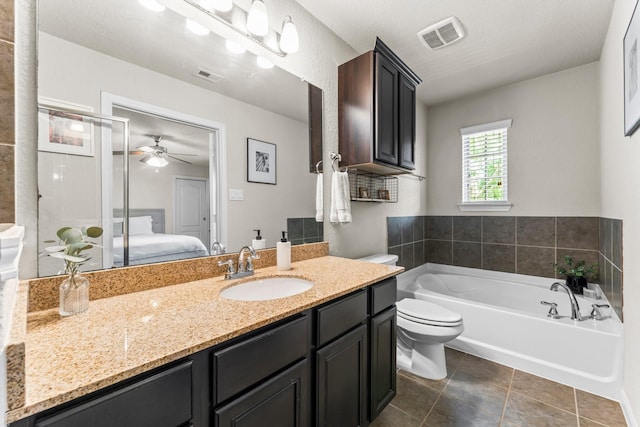 4663 Trembling Forest Ln, Houston, TX 77092 - ensuite bathroom featuring a garden tub, vanity, a ceiling fan, and tile patterned flooring