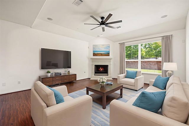 6230 Ledger Ln, Missouri City, TX 77459 - living room with a ceiling fan, wood finished floors, a warm lit fireplace, and vaulted ceiling