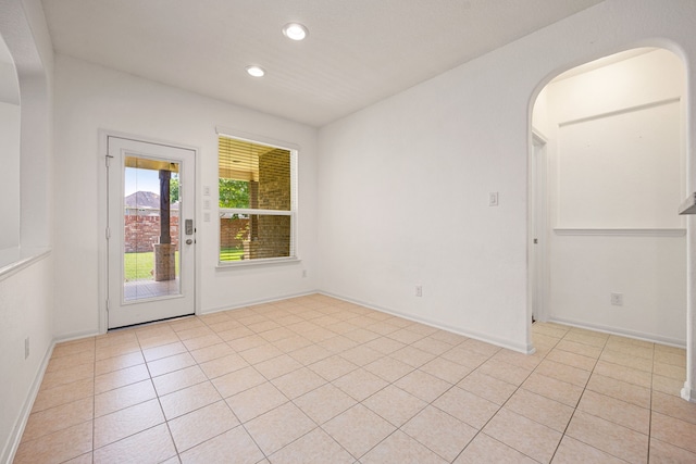 6230 Ledger Ln, Missouri City, TX 77459 - unfurnished room featuring arched walkways, recessed lighting, and light tile patterned floors