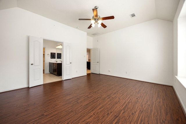 6230 Ledger Ln, Missouri City, TX 77459 - unfurnished room with ceiling fan, wood finished floors, vaulted ceiling, and a chandelier