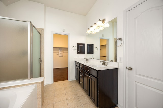 6230 Ledger Ln, Missouri City, TX 77459 - bathroom featuring a shower stall, a walk in closet, and double vanity