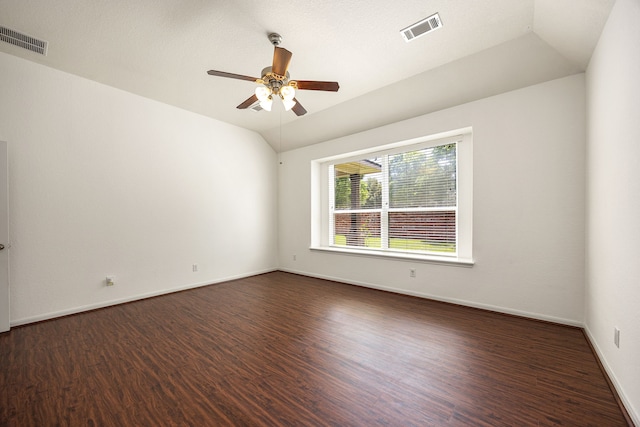6230 Ledger Ln, Missouri City, TX 77459 - spare room featuring dark wood-type flooring, ceiling fan, and vaulted ceiling
