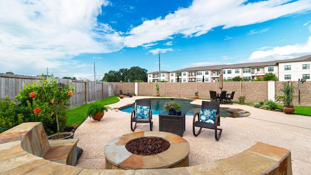 19334 St Winfred Dr, Spring, TX 77379 - view of pool with a patio, an outdoor fire pit, and a fenced backyard