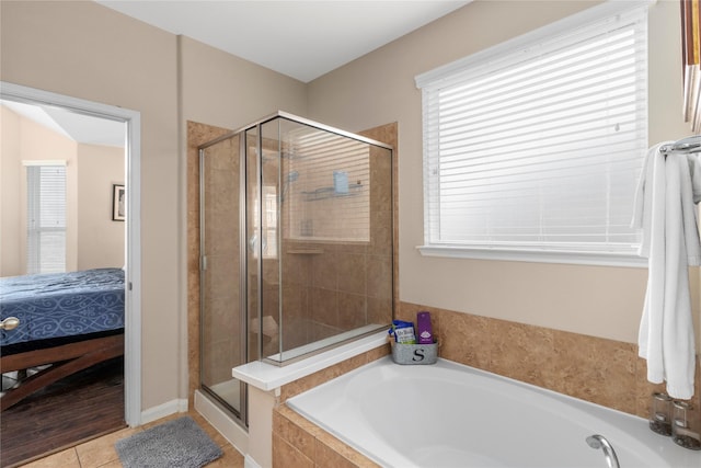 19334 St Winfred Dr, Spring, TX 77379 - full bath featuring a garden tub, a shower stall, ensuite bathroom, and tile patterned floors