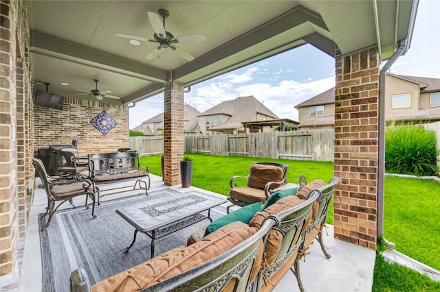 3411 Brampton Island Dr, Katy, TX 77494 - fenced backyard featuring a ceiling fan, an outdoor hangout area, and a patio