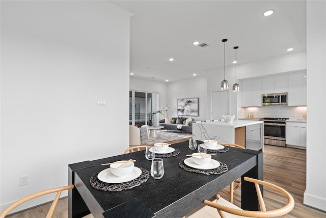 216 E 31st 1/2 St Unit B, Houston, TX 77018 - dining area with light wood finished floors and recessed lighting
