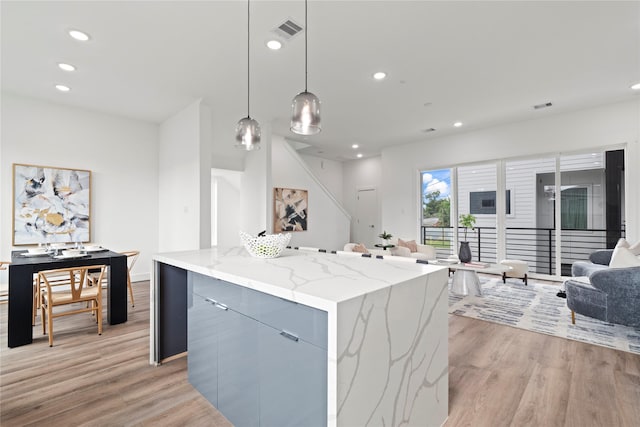 216 E 31st 1/2 St Unit B, Houston, TX 77018 - kitchen featuring open floor plan, light wood-style floors, modern cabinets, recessed lighting, and hanging light fixtures