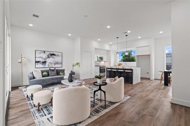 216 E 31st 1/2 St Unit B, Houston, TX 77018 - living room with recessed lighting and light wood-style flooring