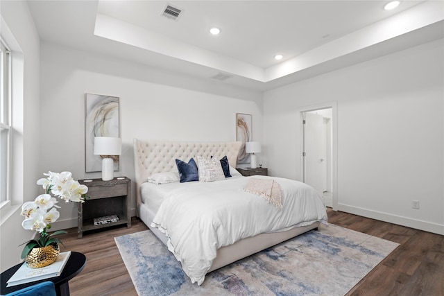 216 E 31st 1/2 St Unit B, Houston, TX 77018 - bedroom featuring a raised ceiling, wood finished floors, and recessed lighting