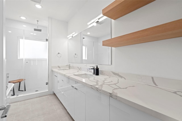 216 E 31st 1/2 St Unit B, Houston, TX 77018 - bathroom featuring a stall shower, double vanity, tile patterned flooring, and recessed lighting