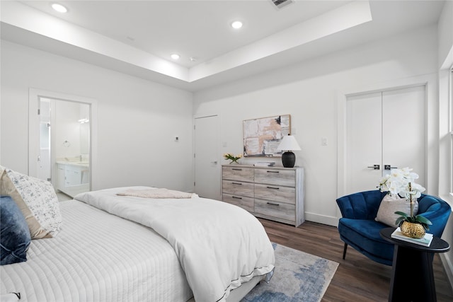 216 E 31st 1/2 St Unit B, Houston, TX 77018 - bedroom featuring dark wood finished floors, recessed lighting, a raised ceiling, and connected bathroom