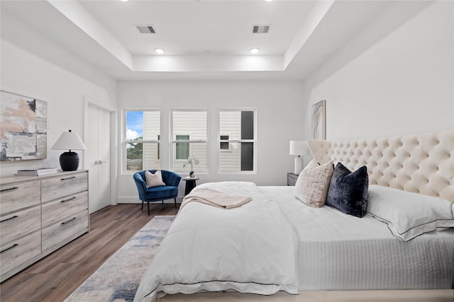 216 E 31st 1/2 St Unit B, Houston, TX 77018 - bedroom featuring wood finished floors, a raised ceiling, and recessed lighting
