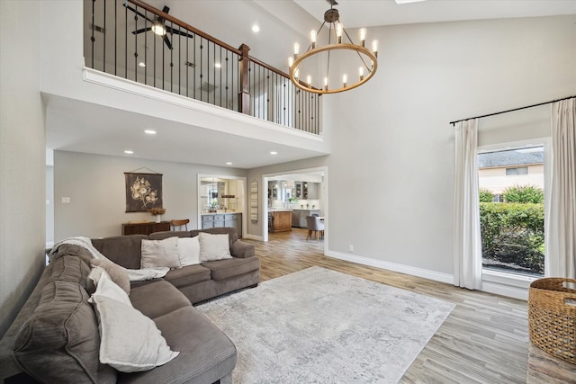 1802 Cedar Creek Ct, Houston, TX 77077 - living area with a towering ceiling, a chandelier, light wood-type flooring, and recessed lighting