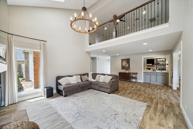 1802 Cedar Creek Ct, Houston, TX 77077 - living area with a high ceiling, a chandelier, light wood-type flooring, and recessed lighting