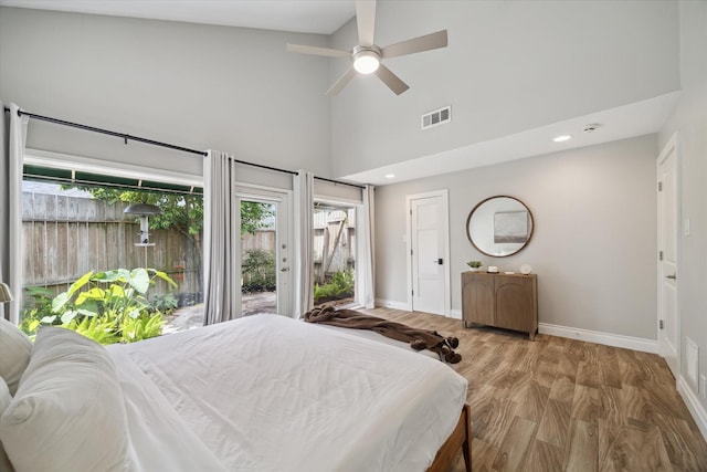 1802 Cedar Creek Ct, Houston, TX 77077 - bedroom featuring access to exterior, high vaulted ceiling, wood finished floors, and ceiling fan