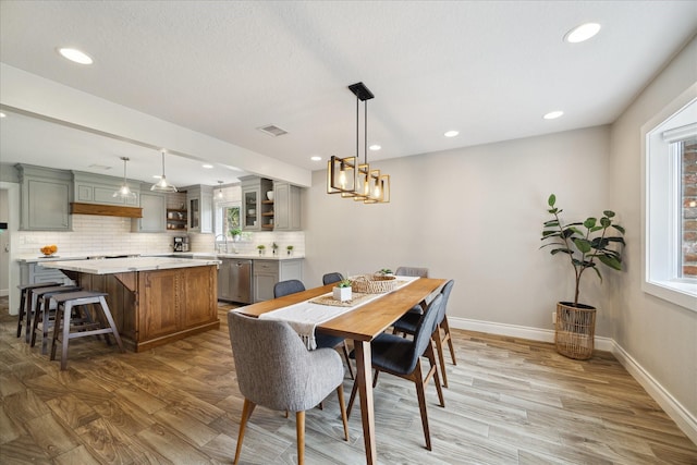 1802 Cedar Creek Ct, Houston, TX 77077 - dining room featuring light wood-style flooring, recessed lighting, and a chandelier