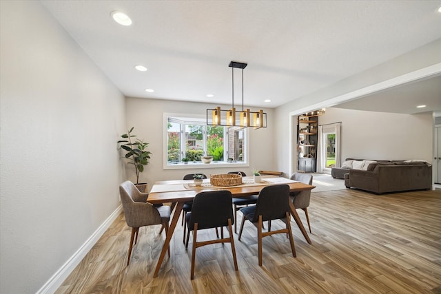 1802 Cedar Creek Ct, Houston, TX 77077 - dining area with light wood-style flooring, recessed lighting, and a chandelier
