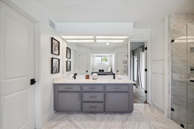 1802 Cedar Creek Ct, Houston, TX 77077 - ensuite bathroom featuring marble look tiles, a shower stall, and double vanity