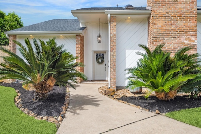 1802 Cedar Creek Ct, Houston, TX 77077 - entrance to property featuring a shingled roof, brick siding, and a chimney