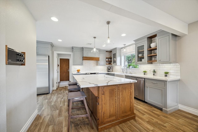 1802 Cedar Creek Ct, Houston, TX 77077 - kitchen featuring open shelves, stainless steel appliances, gray cabinetry, light wood-style flooring, and recessed lighting