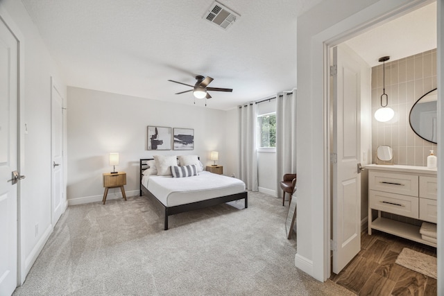 1802 Cedar Creek Ct, Houston, TX 77077 - carpeted bedroom with baseboards and a ceiling fan