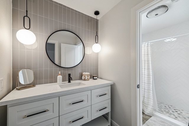 1802 Cedar Creek Ct, Houston, TX 77077 - full bath with vanity, backsplash, tiled shower, and tile walls