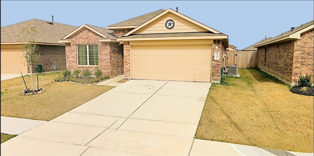 15455 Picea Azul St, Channelview, TX 77530 - single story home featuring brick siding, driveway, an attached garage, and roof with shingles