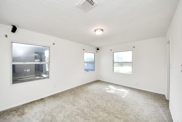 1404 Aldrich St, Houston, TX 77055 - carpeted empty room featuring a textured ceiling and baseboards