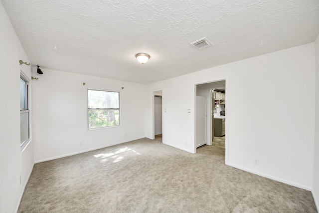1404 Aldrich St, Houston, TX 77055 - unfurnished room featuring light colored carpet and a textured ceiling