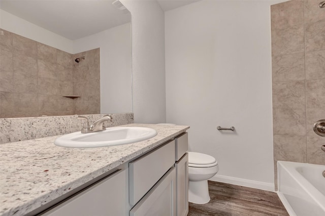 1316 Farquhar St, Navasota, TX 77868 - full bath with vanity, wood finished floors, and shower / bath combination