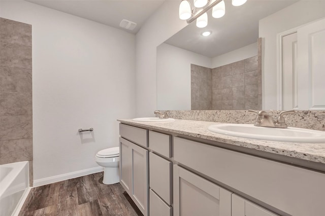 1316 Farquhar St, Navasota, TX 77868 - full bath featuring double vanity and wood finished floors